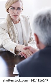 Business people shaking hands at meeting table - Shutterstock ID 1414116149