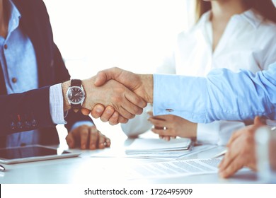 Business People Shaking Hands At Meeting Or Negotiation, Close-up. Group Of Unknown Businessmen And Women In Modern Office. Teamwork, Partnership And Handshake Concept, Toned Picture