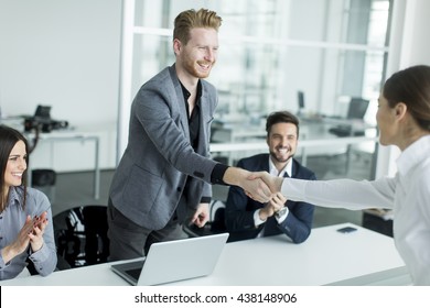 Business People Shaking Hands In The Office After A Job Well Done