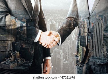 Business People Shaking Hands On New York City Background. Concept Of Partnership. Double Exposure