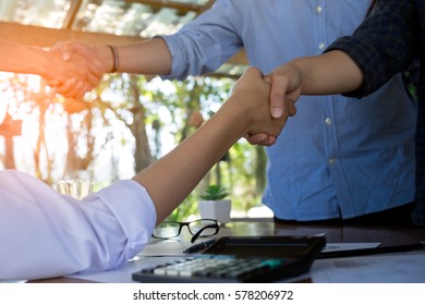 Business People Shaking Hands Over Table, Finishing Up A Meeting