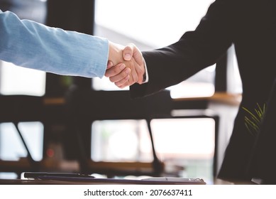 Business People Shaking Hands At Work Teamwork