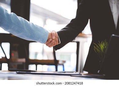 Business People Shaking Hands At Work Teamwork
