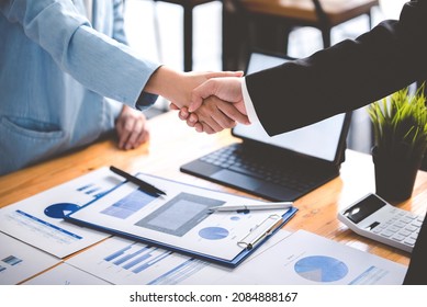 Business People Shaking Hands At Work Teamwork