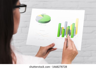 Business people showing charts and statistics