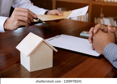 Business people signing contract making a deal with real estate agent Concept for consultant and home insurance concept - Shutterstock ID 1200978241