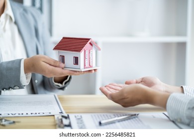 Business people signing contract making deal with real estate agent Concept for consultant home insuranceReal estate investment Property insurance security. Real estate agent offer house. - Shutterstock ID 2256485821
