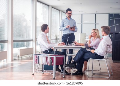 Business People Sitting At Corporate Meeting