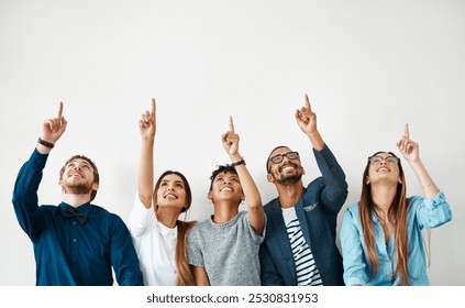 Business people, smile and group pointing up for mockup, wall and white background space. Creative employees, teamwork and diversity with hand gesture, collaboration and decision for choice approval - Powered by Shutterstock