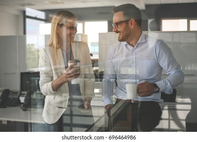 Business People Standing In Office And Having Break . Business Woman Holding Digital Tablet.