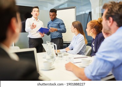 Business People In The Start-up Team Discuss A Project In A Workshop Or Meeting