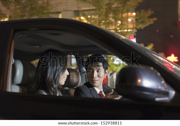 Business People Talking In\
Car