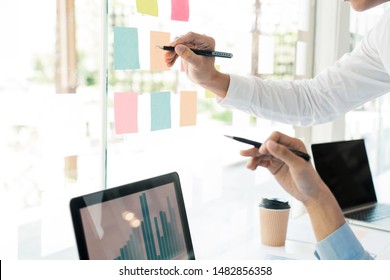 Business People Talking Discussing with coworker planning analyzing financial document data charts and graphs in Meeting and  successful teamwork Concept - Powered by Shutterstock - Get 15% off with code: PIKWIZARD15