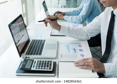 Business People Talking Discussing with coworker planning analyzing financial document data charts and graphs in Meeting and  successful teamwork Concept - Powered by Shutterstock - Get 15% off with code: PIKWIZARD15
