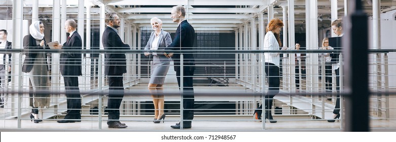 Business People Talking In Industrial Style Office, Panorama