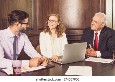 Business People Talking And Smiling To Each Other