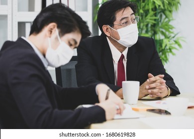 Business People Team Colleagues Wearing Hygienic Protective Mask On Face Meeting Together In Company Office. Idea For Prevent And Safe From Disease And Outbreak Of Coronavirus, Coivid-2019 Virus.