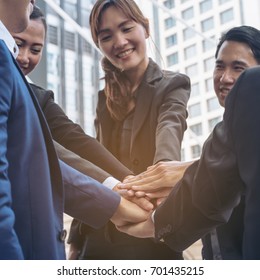 Business people or business team joining hands showing teamwork, collaboration and unity. Concept of business success with teamwork in business. - Shutterstock ID 701435215