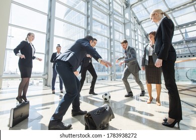 Business People Team Playing Soccer Having Fun In Office