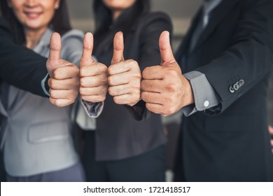 Business People Teams Giving Thumbs Up While Standing In Office Workplace, Close Up Of Confident Business Officer Teamwork Showing Thumbs-up Satisfied ​for Work Warranty Trust. Trustworthy Concept