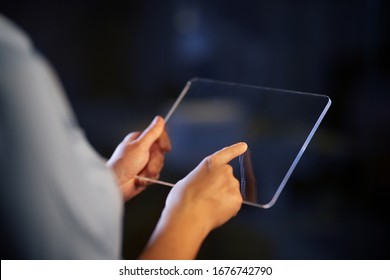 business, people and technology concept - close up of hands with transparent tablet pc computer - Powered by Shutterstock