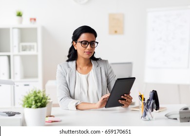 business, people and technology concept - smiling businesswoman with tablet pc computer at office