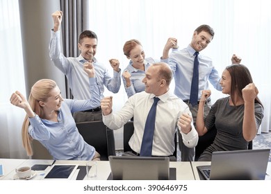 Business, People, Technology, Gesture And Teamwork Concept - Smiling Business Team Raising Hands And Celebrating Victory In Office