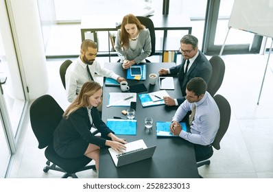 Business people, top view and group discussion with laptop for construction, design and planning in office. Team, manager and collaboration on computer for architecture project and review blueprint - Powered by Shutterstock