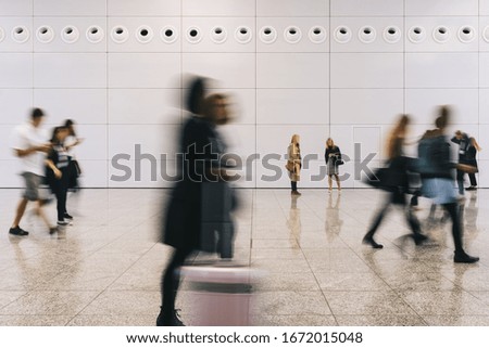 Business people traveling in hall from the airport