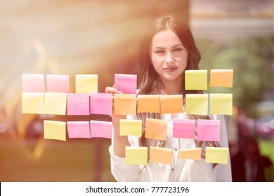 Business People Trough Glass With Post Its