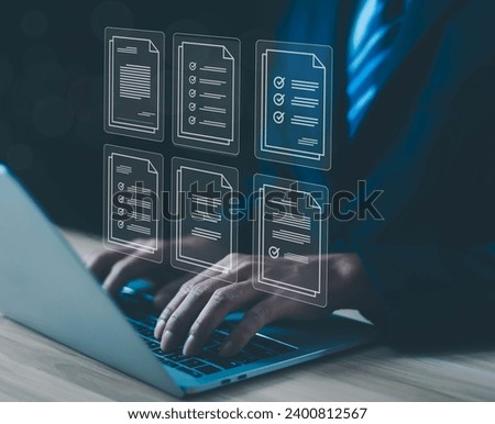 Business people use computers to upload documents from folders to manage online document databases and organize file space on a software system. To disseminate information in various agency offices