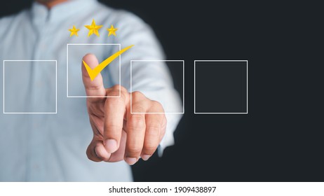 Business people use the index finger to touch the virtual screen to select the starred icons, future digital technology working in digital form, business strategy concepts, human business concepts.