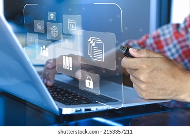 Business people using a computer to document management concept, records keeping, database technology, file access, doc sharing and security of data with smart computers on computer screen background - Shutterstock ID 2153357211