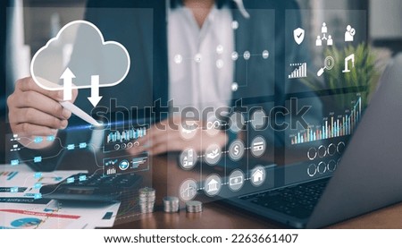 Business people using laptop with analytic graph and growing graph on virtual reality, graph investments for analysis market and demand.