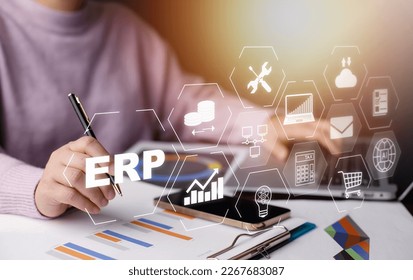 Business people using a laptop with document management for ERP. Enterprise resource planning concept,Enterprise Resource Management ERP software system for business resources plan presented. - Powered by Shutterstock