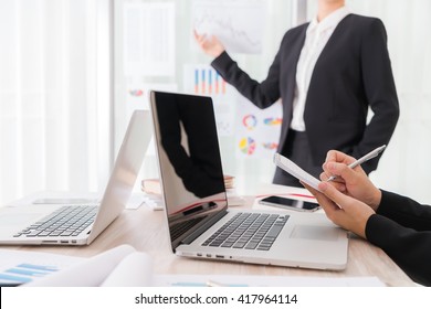 Business people using laptop  and Financial charts  at meeting office - Shutterstock ID 417964114
