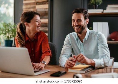 Business people using laptop together. 
Business colleagues having meeting in office - Shutterstock ID 1785725096