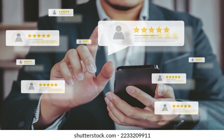 Business people using smartphone and pressing review popup on visual screen, customer review by five star feedback, positive customer feedback testimonial.	