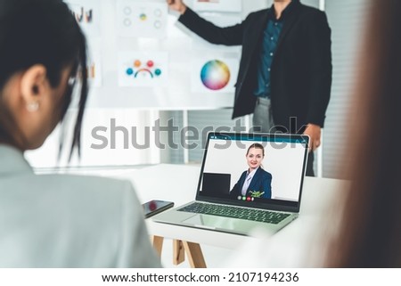 Business people in video call meeting proficiently discuss business plan in office and virual workplace . Telework conference call using smart video technology to communicate colleague .