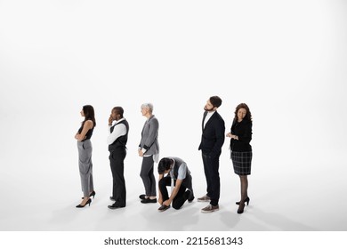 Business people waiting in a row, tying shoe in queue against white background - Powered by Shutterstock