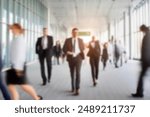 business people walking in the corridor of an business center, pronounced motion blur, crowded bright modern light office movement defocused. office background busy. talking and rushing in the lobby.