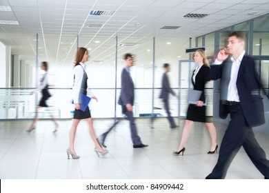 Business People Walking In The Office Corridor