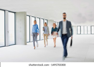 Business People Walking In Office Hall