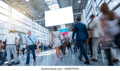 Business People Walking On Trade Fair