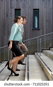 Business People Walking Up Steps