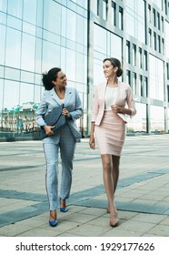 Business People Walking And Talking In The Street