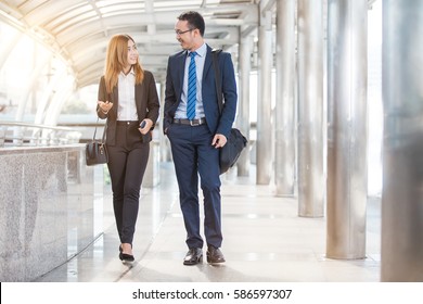 Business People Walking And Talking In The Street