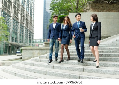 Business People Walking Together On Street
