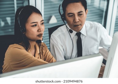 Business People Wearing Headset Working Actively In Office . Call Center, Telemarketing, Customer Support Agent Provide Service On Telephone Video Conference Call.