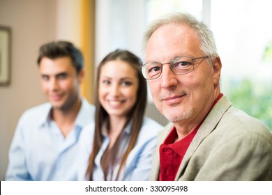 Business People Wearing Informal Dresses At Work In Their Office